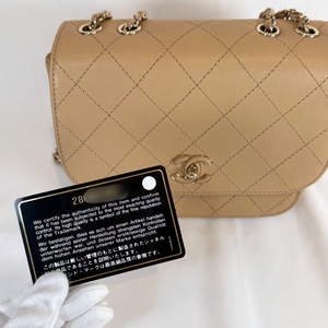 CHANEL Beige Quilted Leather Covered CC Small Crossbody Bag